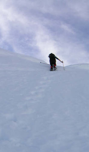 Snowshoeing up steep snow